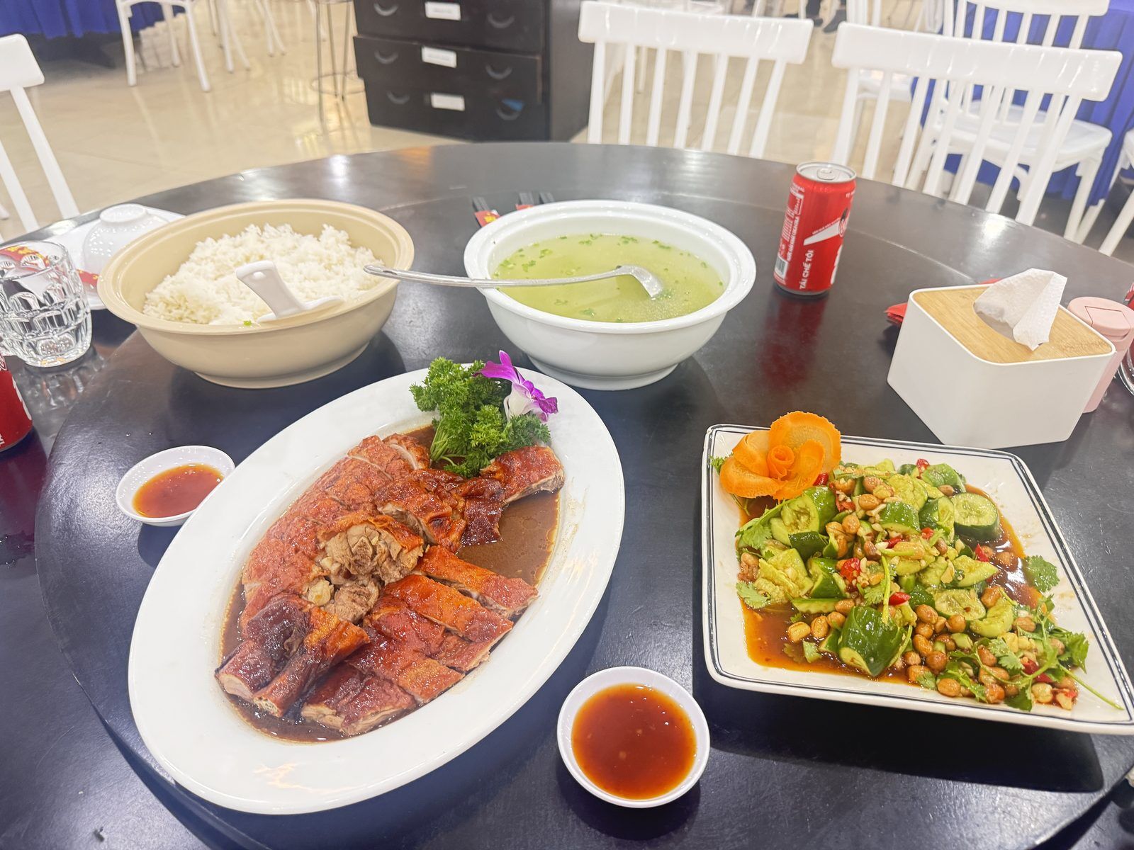 Roast duck dinner with rice, soup and smashed cucumber salad at a city center restaurant in Da Nang