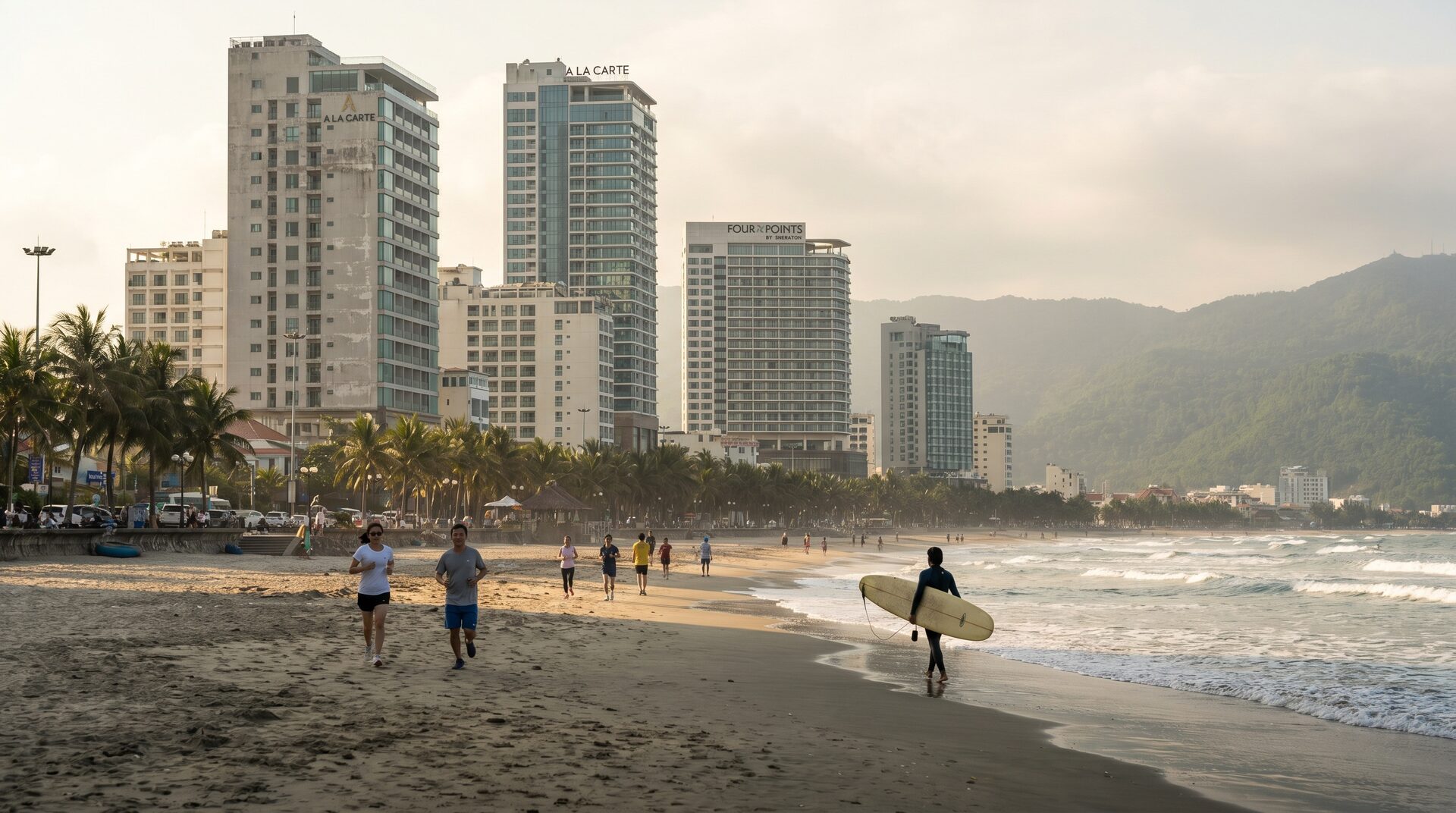 Da Nang city skyline along My Khe beach with mountains in the distance