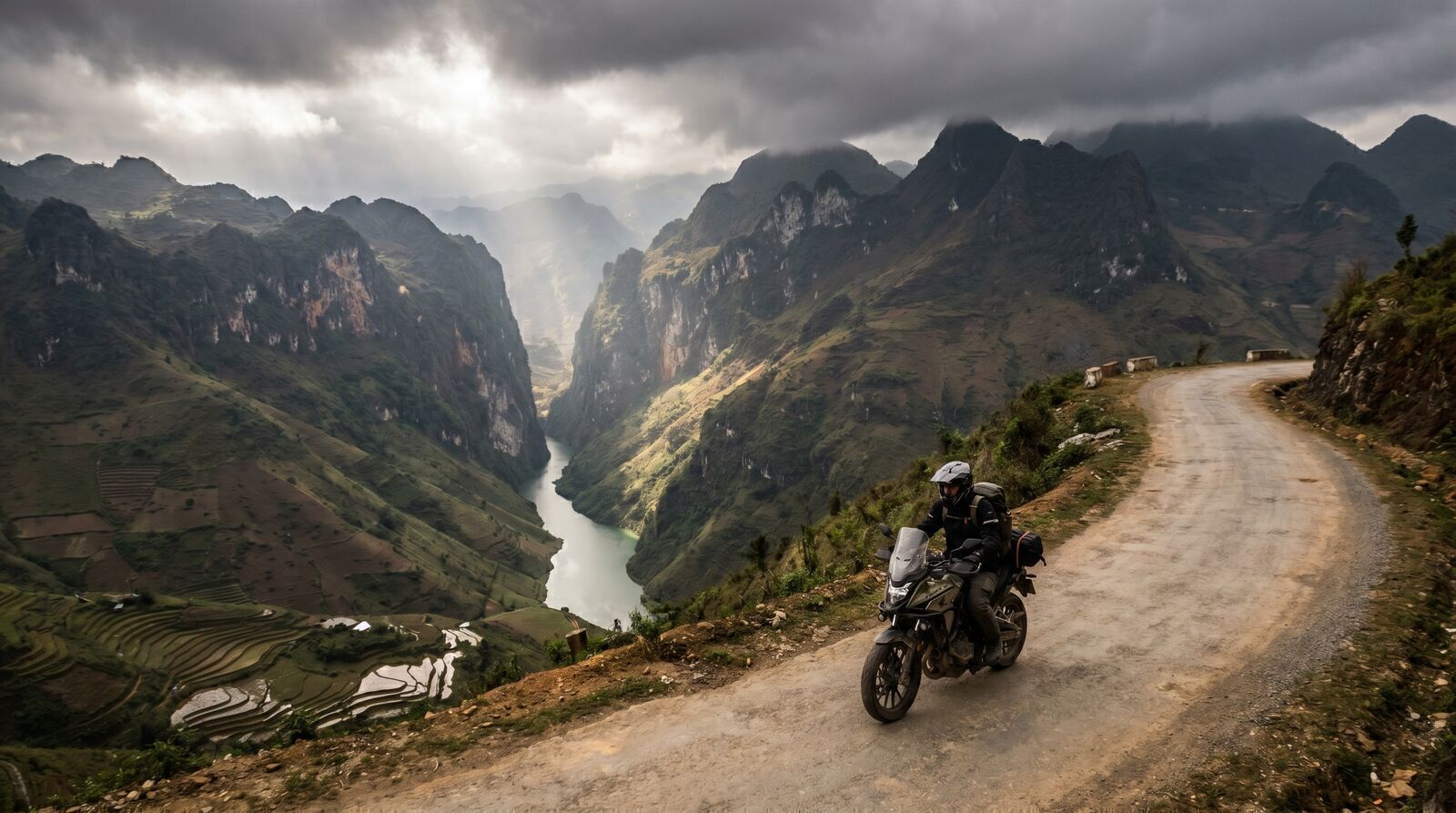 Motorbike rider on winding mountain road of the Ha Giang loop Vietnam