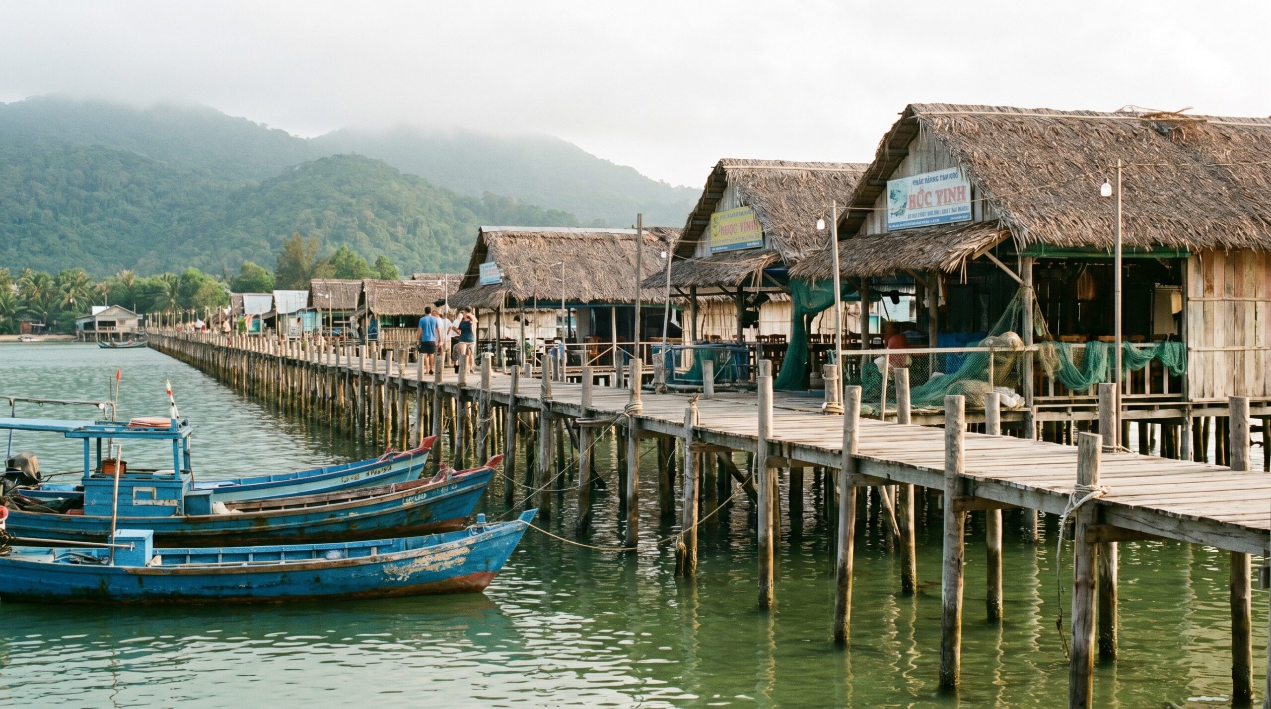 Wooden stilt pier and fishing boats at Ham Ninh village Phu Quoc