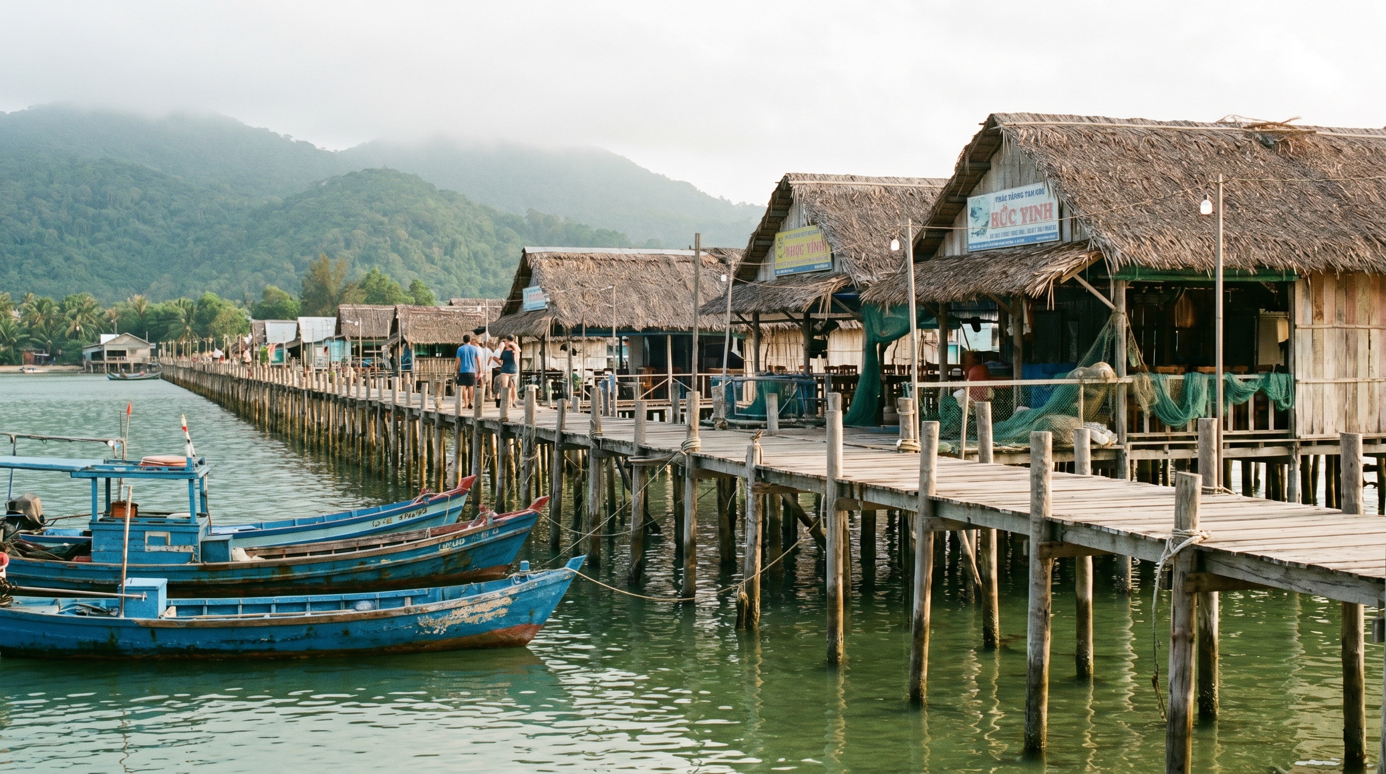 Wooden stilt pier and fishing boats at Ham Ninh village Phu Quoc