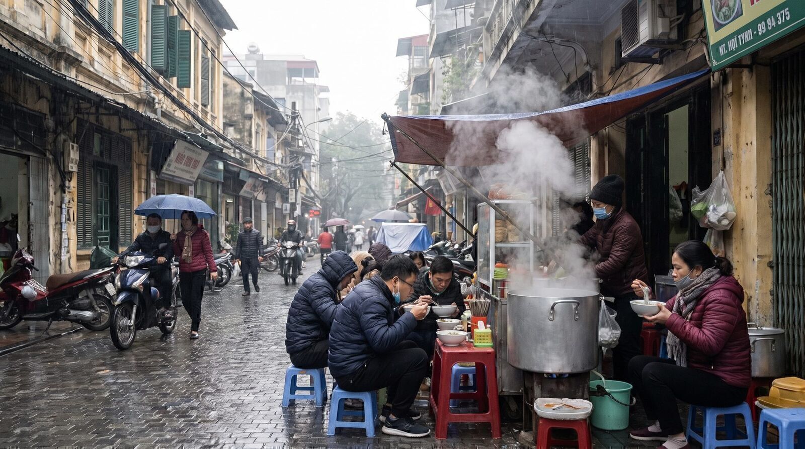 Steam rising from a pho pot at a Hanoi street stall on a cold grey January morning with locals in winter coats
