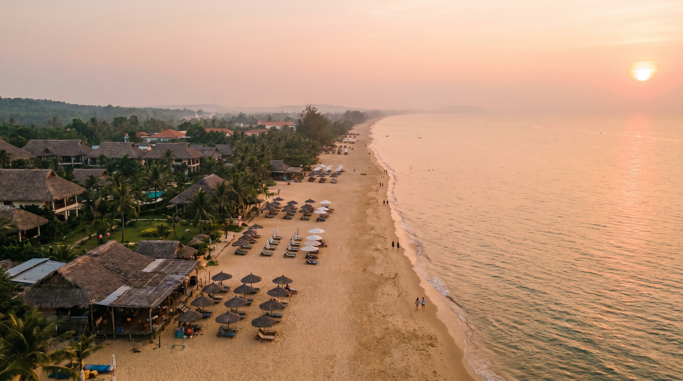 Aerial view of Long Beach Phu Quoc with resorts along the golden sand at sunset