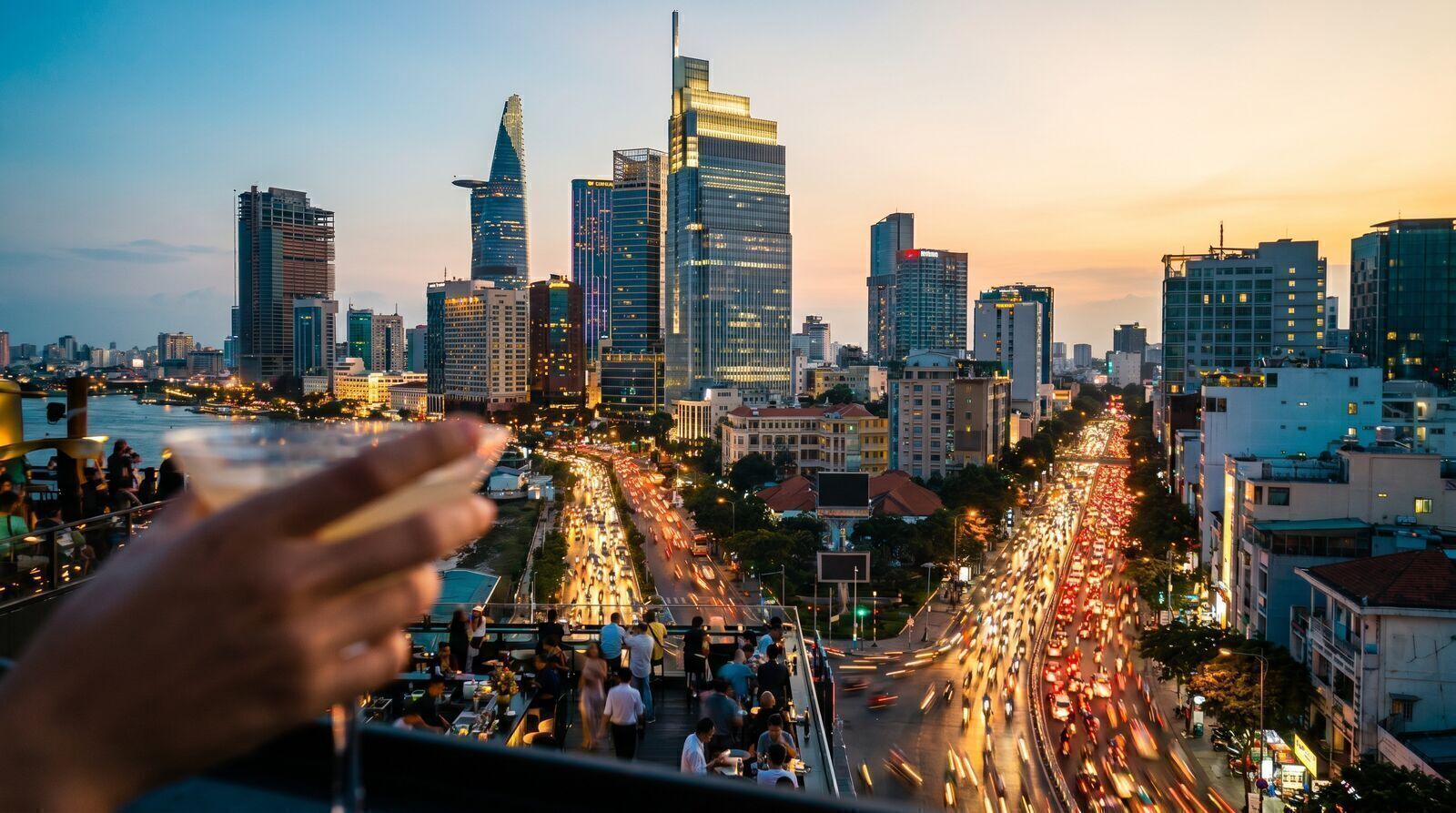 Saigon skyline at blue hour with motorbike light trails